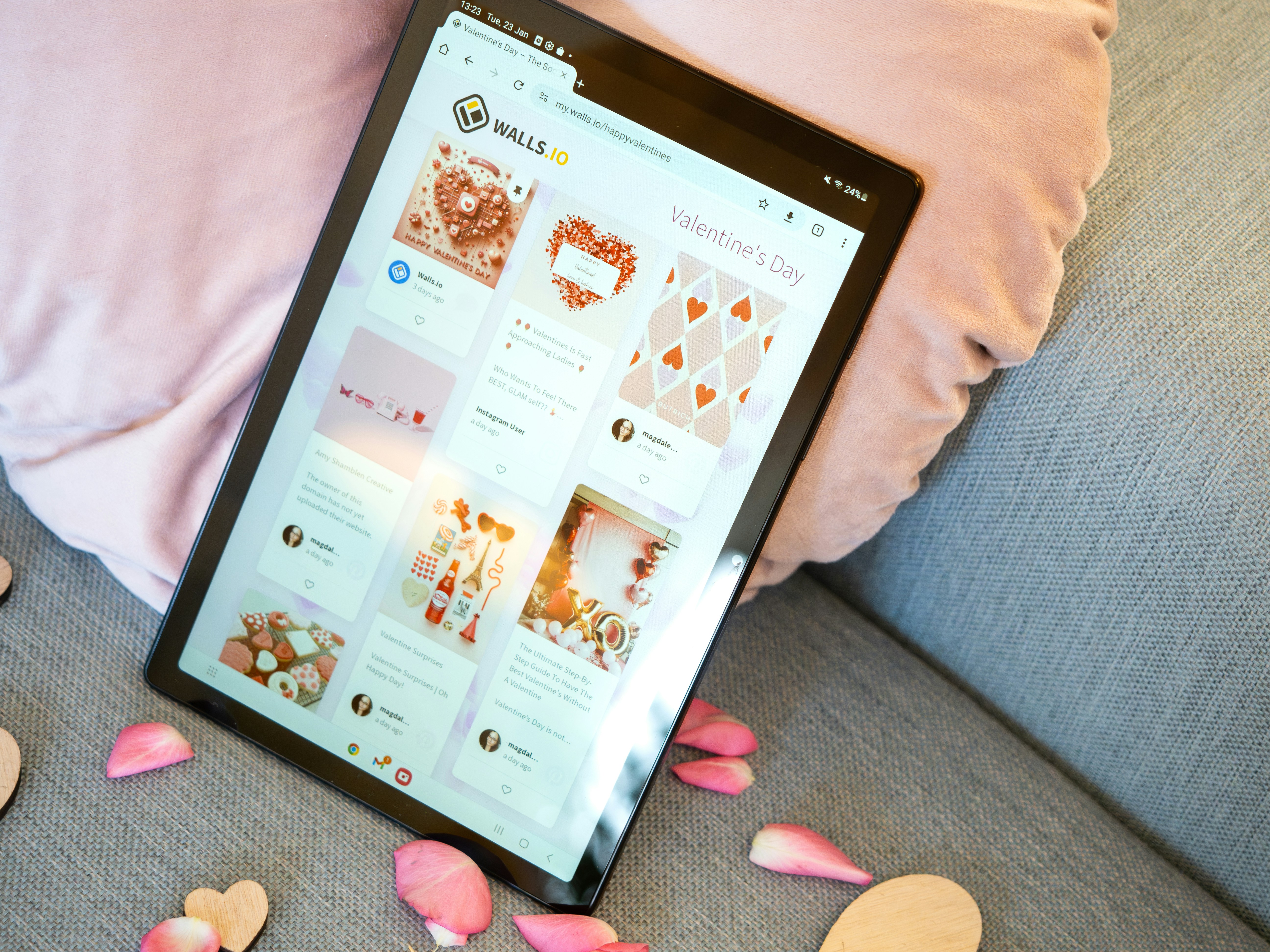 Tablet showing a Valentine's Day Social Wall and romantic decoration